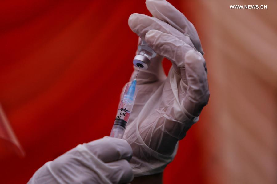 Medical workers work at vaccination room in Kathmandu, Nepal