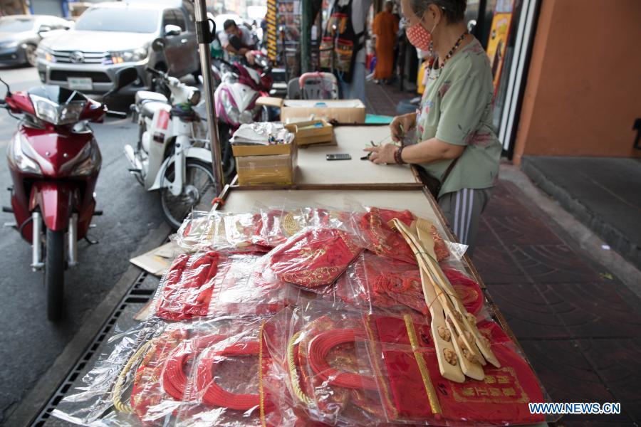 People buy spring couplets and other decorations for upcoming Chinese Lunar New Year in Bangkok