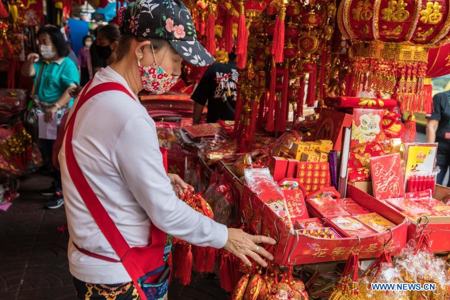 People buy spring couplets and other decorations for upcoming Chinese Lunar New Year in Bangkok