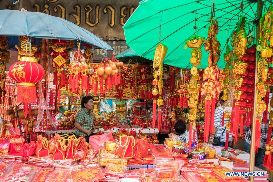 People buy spring couplets and other decorations for upcoming Chinese Lunar New Year in Bangkok