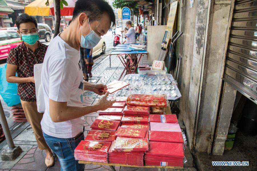 People buy spring couplets and other decorations for upcoming Chinese Lunar New Year in Bangkok