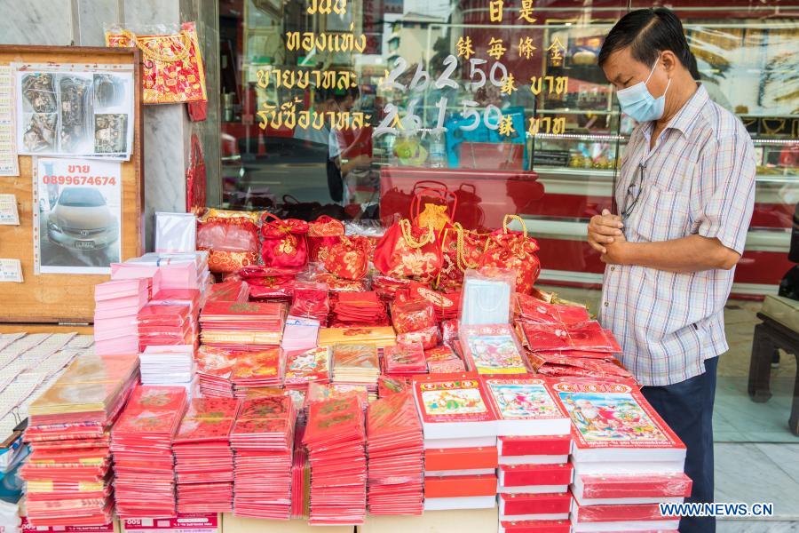 People buy spring couplets and other decorations for upcoming Chinese Lunar New Year in Bangkok