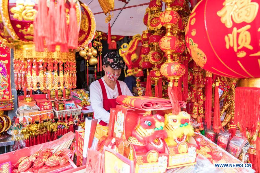 People buy spring couplets and other decorations for upcoming Chinese Lunar New Year in Bangkok