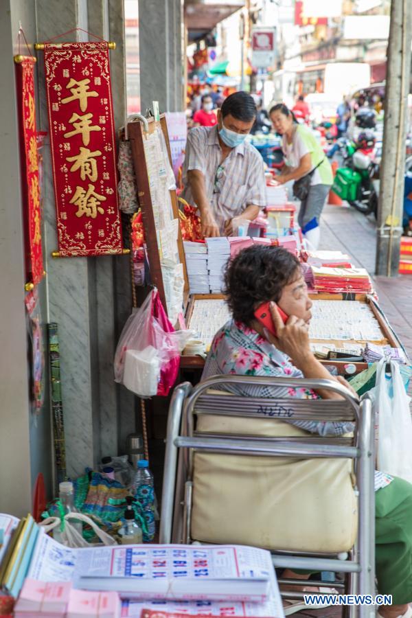 People buy spring couplets and other decorations for upcoming Chinese Lunar New Year in Bangkok