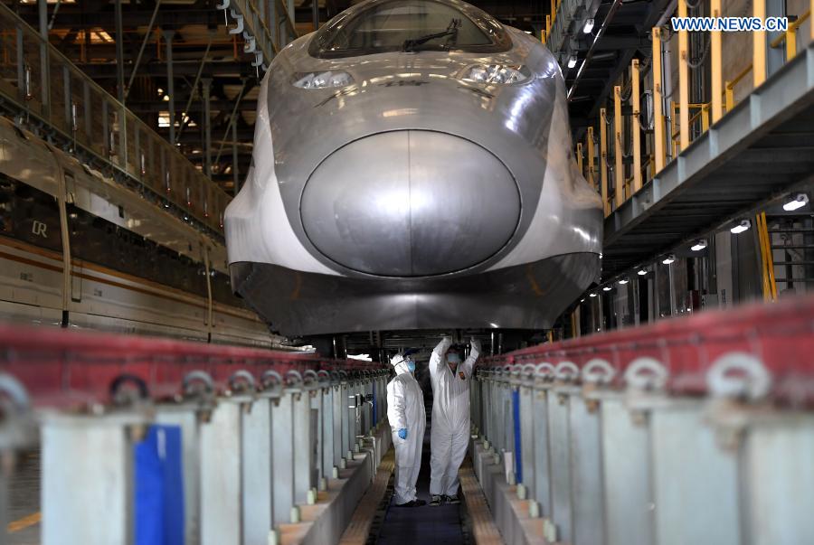 Staff members renew the air conditioner filter of a bullet train at a maintenance base in Zhengzhou, central China’s Henan Province, Jan. 28, 2021. Zhengzhou section of China Railway Zhengzhou Bureau Group Co., Ltd. carries out maintenance work and epidemic precaution for trains to prepare for the country’s annual Spring Festival travel rush. (Xinhua/Li An)