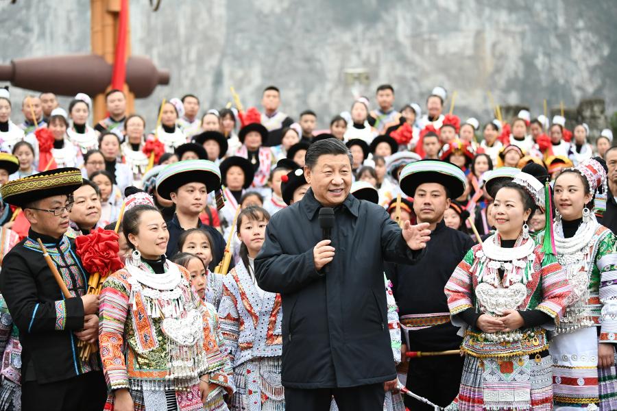 Chinese President Xi Jinping, also general secretary of the Communist Party of China Central Committee and chairman of the Central Military Commission, talks to villagers who are participating in festive activities, and extends his New Year’s greetings to people of all ethnic groups across the country, on a public square of Huawu Village, Xinren Miao Township of Qianxi County, Bijie, southwest China’s Guizhou Province, Feb. 3, 2021. Xi on Wednesday inspected southwest China’s Guizhou Province ahead of the Spring Festival, or the Chinese Lunar New Year. (Xinhua/Xie Huanchi)