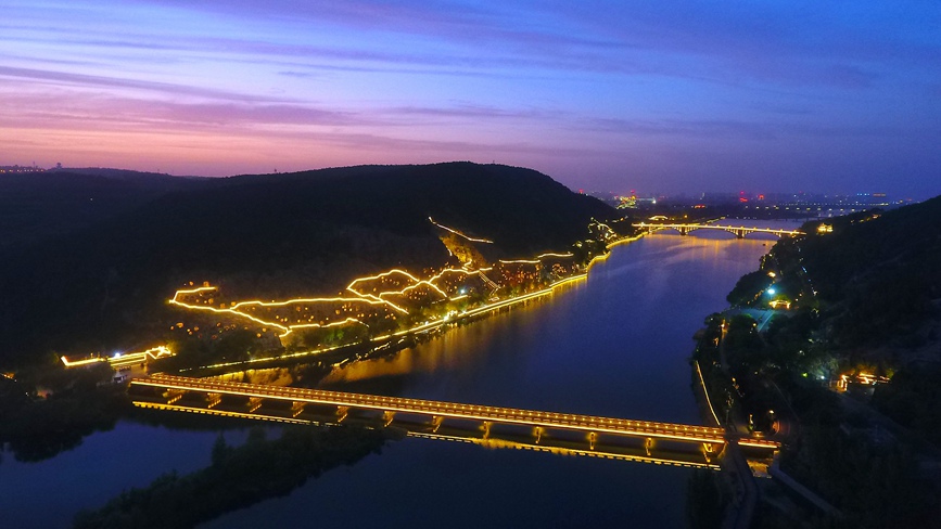 Grottoes in central China welcome vistors at dusk