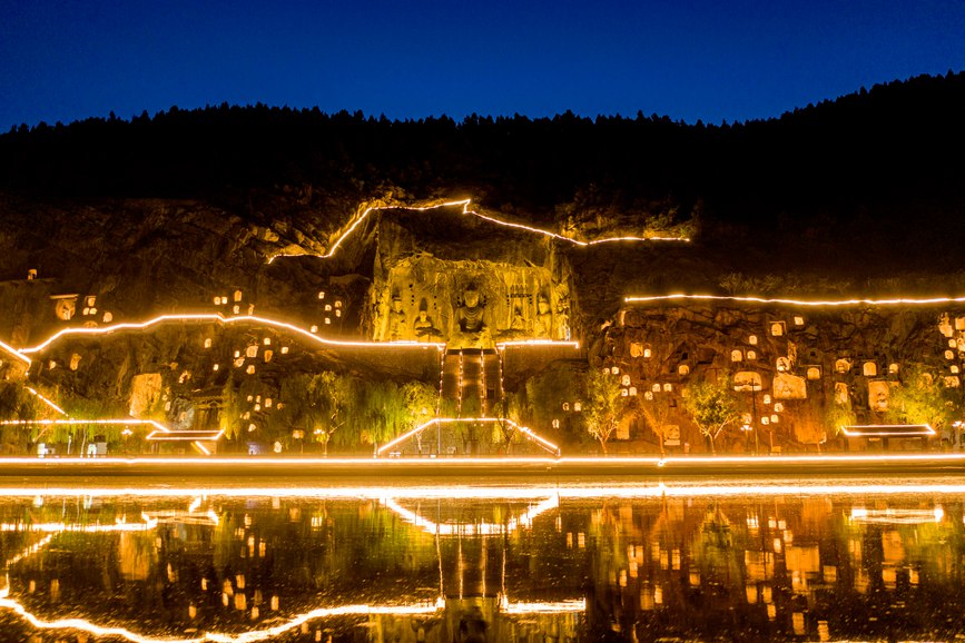 Grottoes in central China welcome vistors at dusk