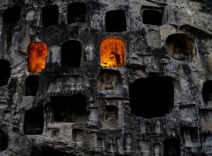 Grottoes in central China welcome vistors at dusk