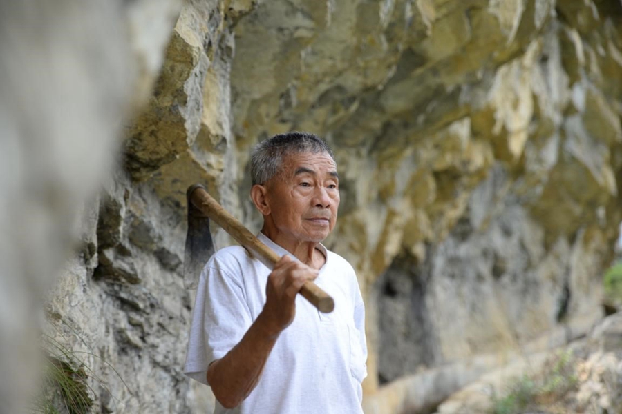 CPC member spent 36 years carving through mountains to bring water to his village