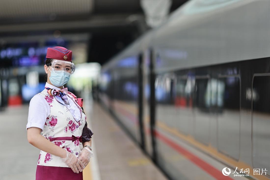 Train attendant witnesses changes brought by high-speed railway service in SW China