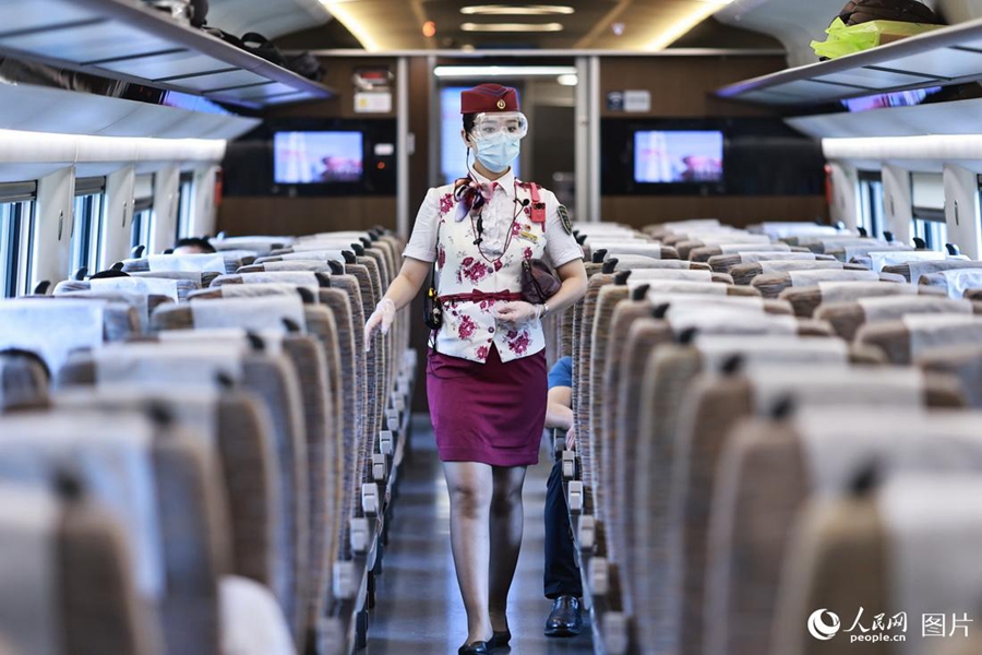 Train attendant witnesses changes brought by high-speed railway service in SW China