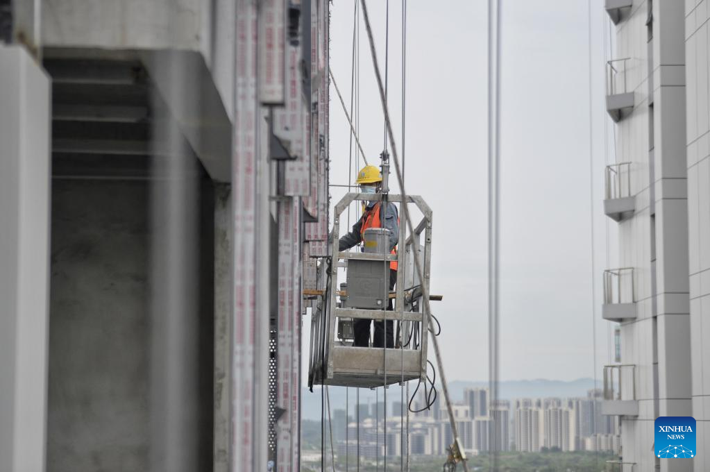 Workers work on construction site during Labor Day holiday in Chengdu