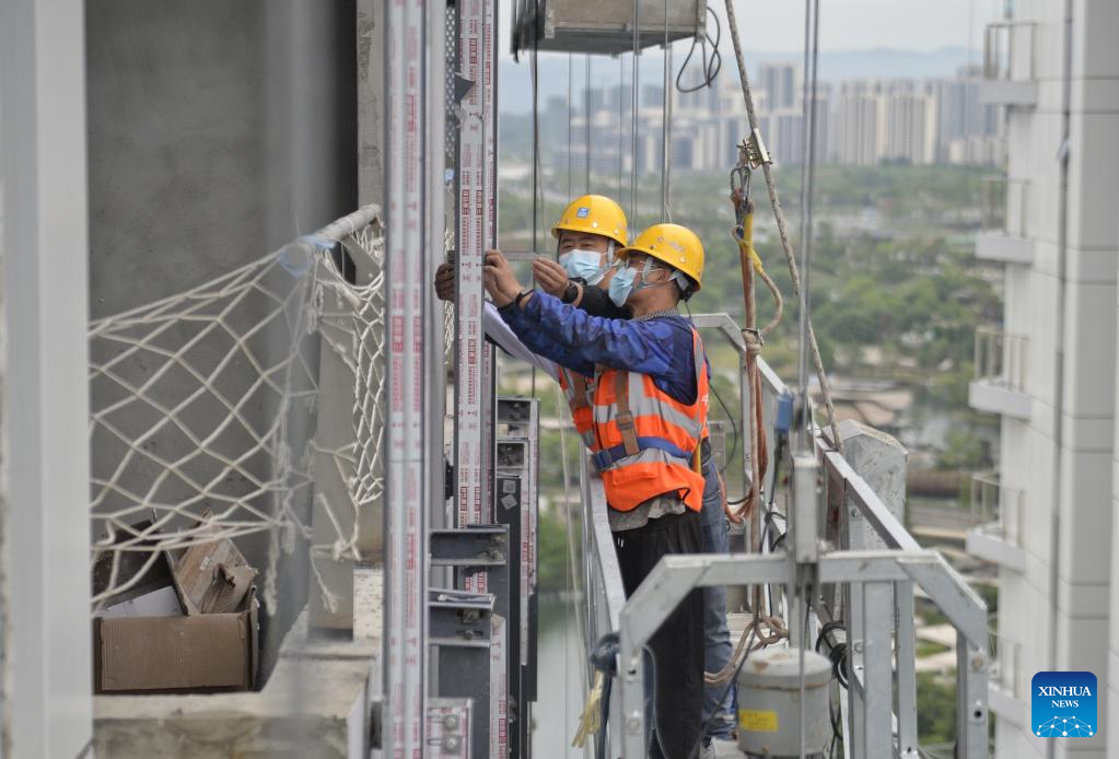 Workers work on construction site during Labor Day holiday in Chengdu