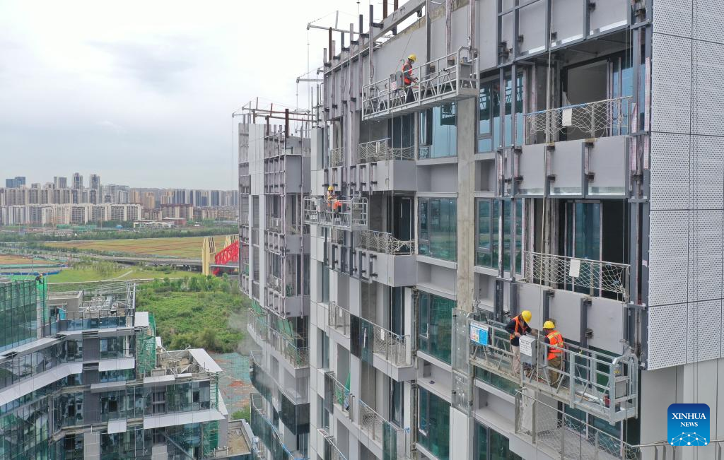 Workers work on construction site during Labor Day holiday in Chengdu