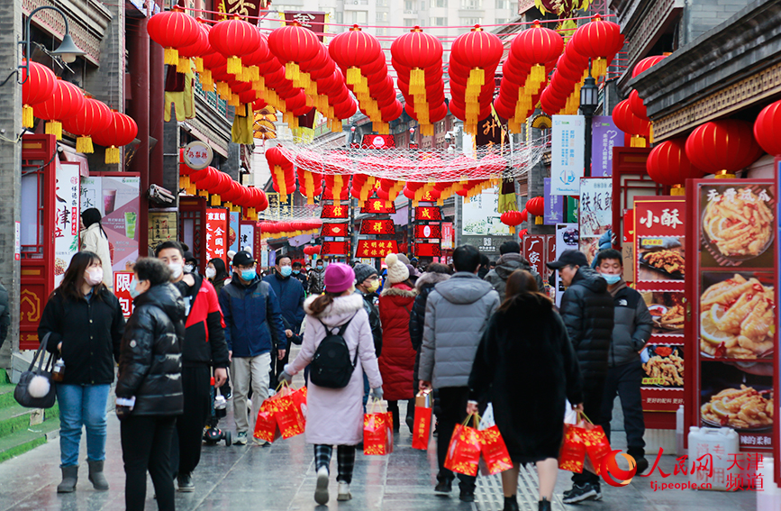 In pics: Commercial street in N China's Tianjin immersed in festive atmosphere 