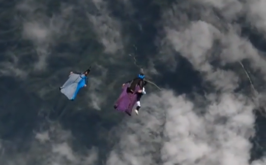 Asia's first tandem wingsuit jump performed in Central China