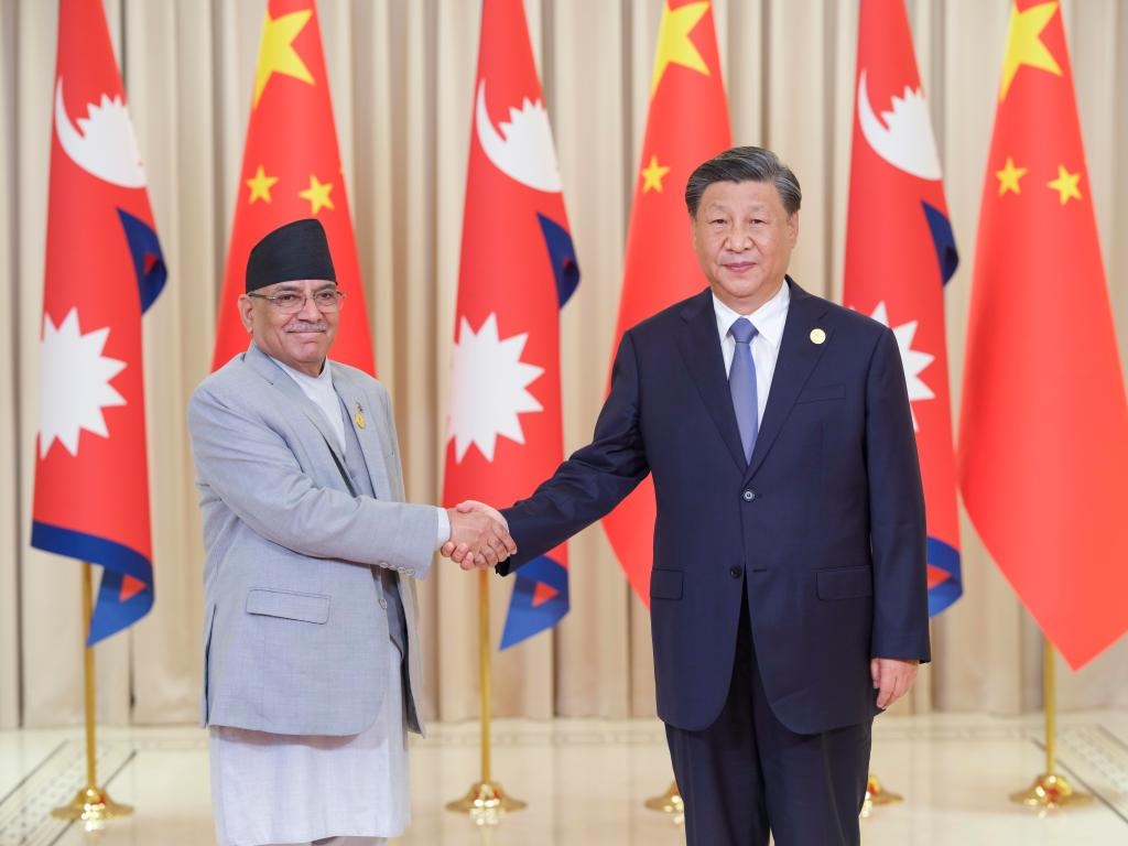 Xi meets Nepalese prime minister