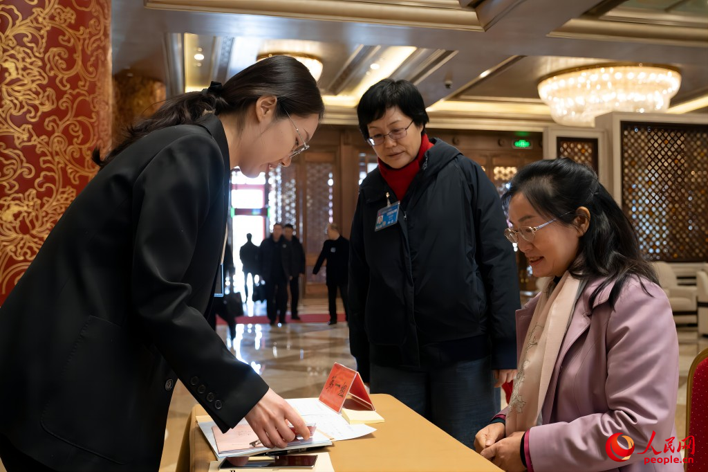 Chinese national lawmakers register for annual session in Beijing