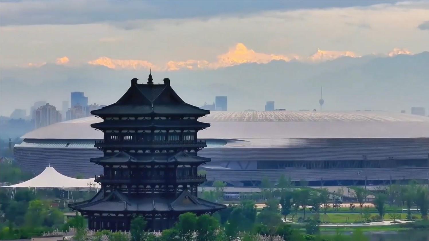 Sunlit snow mountains blend harmoniously with Chengdu's urban architecture