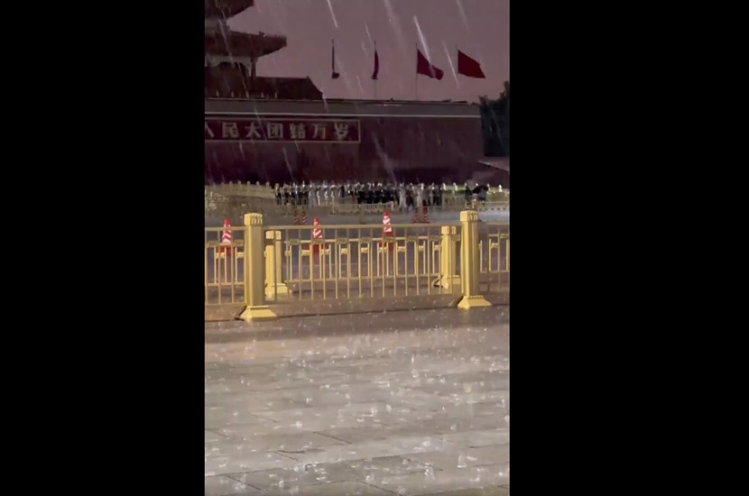 Guards lower flag during storm