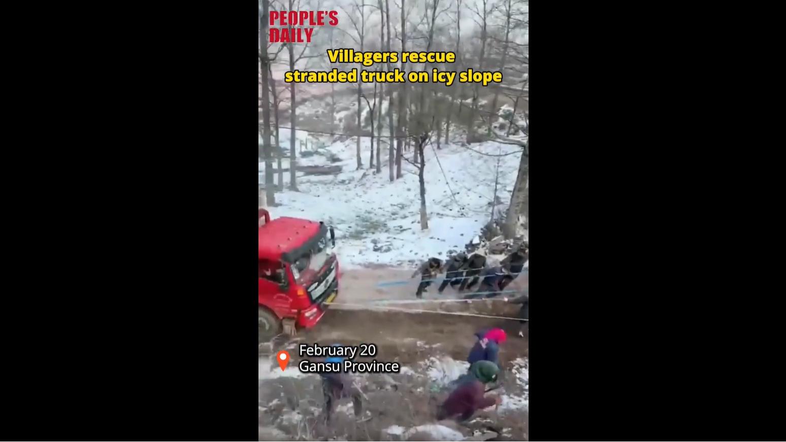 Villagers rescue stranded truck on icy slope