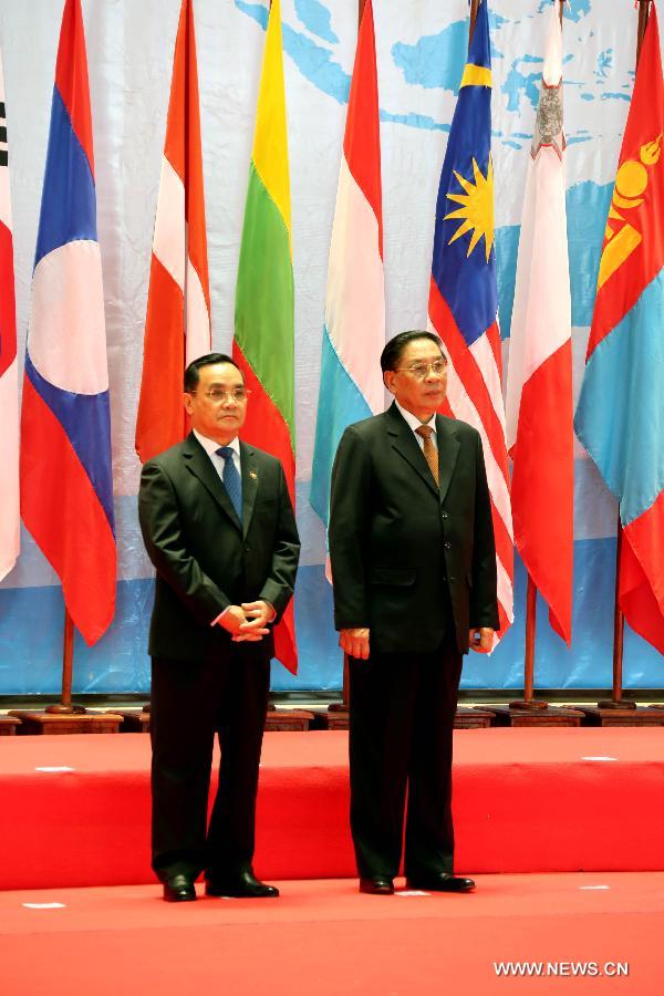 Lao President Choummaly Saygnasone (R) and Lao Prime Minister Thongsing Thammavong attend the opening ceremony of the Ninth Asia-Europe Meeting (ASEM) Summit in Laos, Vientiane, Nov. 5, 2012. Leaders from Asian and European opened the Ninth Asia-Europe Meeting (ASEM) Summit in Lao capital of Vientiane on Monday with economic and financial issues featuring high on the agenda. (Xinhua/Li Peng)