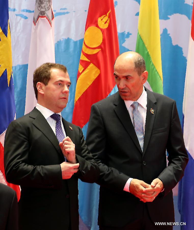 Slovenian Prime Minister Janez Jansa (R) talks with his Russian counterpart Dmitry Medvedev before the opening ceremony of the Ninth Asia-Europe Meeting (ASEM) Summit in Laos, Vientiane, Nov. 5, 2012. Leaders from Asian and European opened the Ninth Asia-Europe Meeting (ASEM) Summit in Lao capital of Vientiane on Monday with economic and financial issues featuring high on the agenda. (Xinhua/Li Peng)