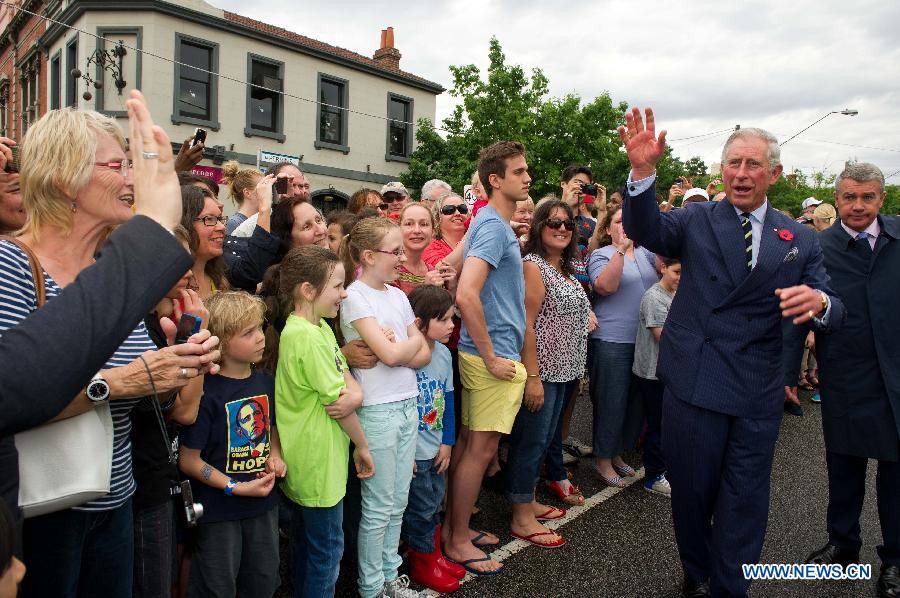 Britain's Prince Charles (2nd R) waves to residents in Melbourne, Australia, Nov. 6, 2012. Prince Charles and his wife Camilla are on a six-day Australian tour to mark the Queen's Diamond Jubilee. (Xinhua/Bai Xue) 