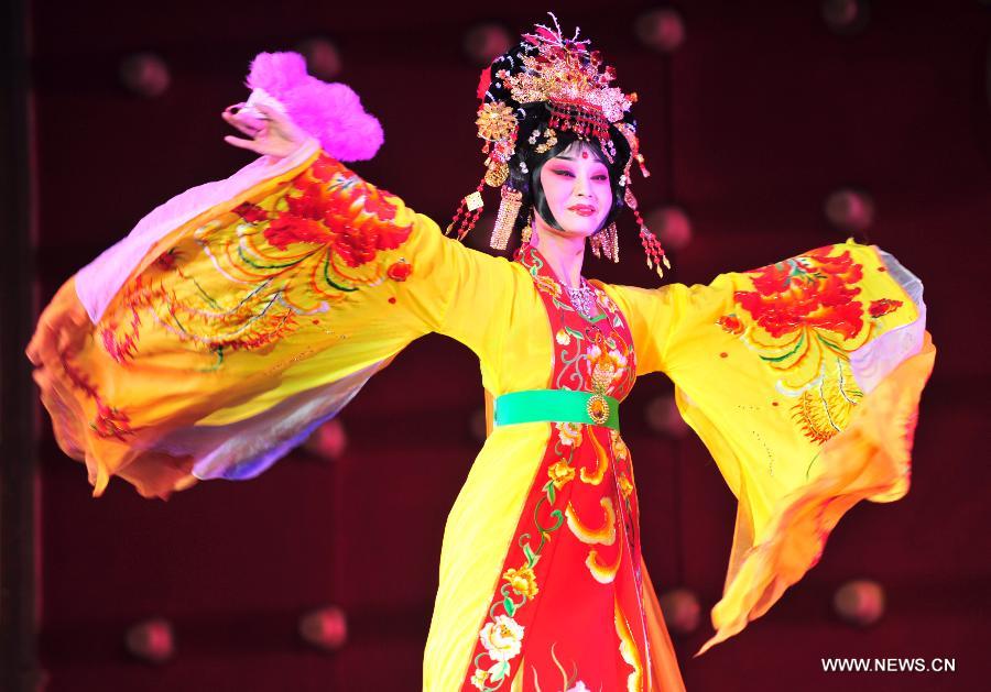 An actress performs Gansu's local drama "Longju" at the Gansu Theater in Lanzhou, capital of northwest China's Gansu Province, Nov. 6, 2012. A performance was held here Tuesday night to celebrate the opening of an eight-day Shaanxi opera art festival. Shaanxi Opera, commonly known as Qinqiang, is the oldest of all the Chinese operas that are still in existence today. (Xinhua/Liang Qiang)