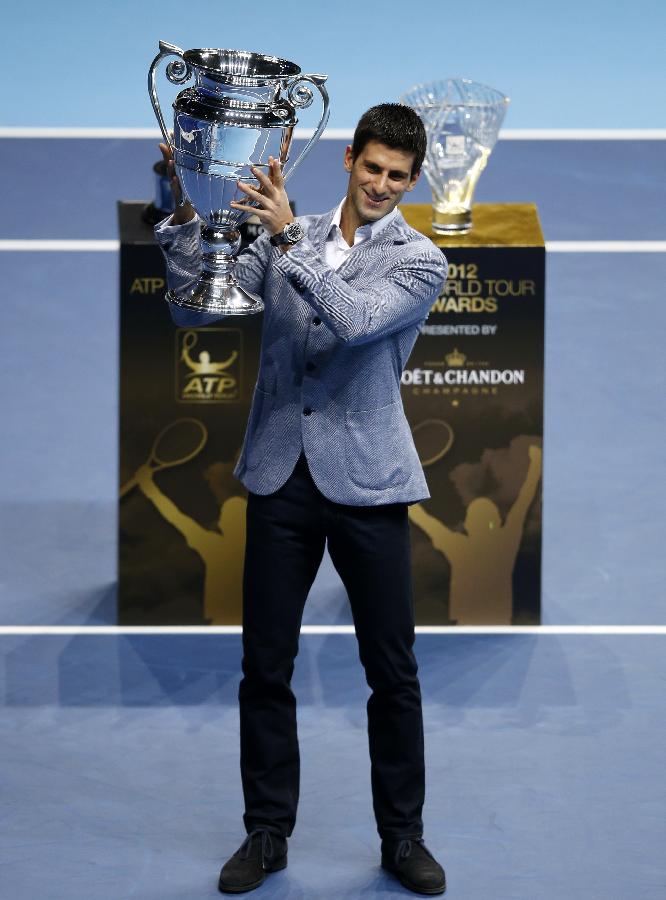 Novak Djokovic of Serbia holds the trophy of the 2012 ATP World Tour No. 1 Award at the O2 Arena in London, Britain, on Nov. 6, 2012. Djokovic was presented the 2012 ATP World Tour No. 1 Award and the Arthur Ashe Humanitarian Award in London Tuesday. (Xinhua/Wang Lili)