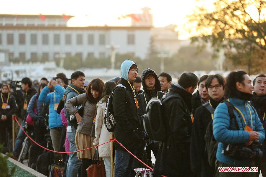 Journalists wait outside the Great Hall of the People, the venue of the opening ceremony of the 18th National Congress of the Communist Party of China (CPC), at the Tian'anmen Square in Beijing, capital of China, Nov. 8, 2012. The 18th CPC National Congress opened in Beijing on Thursday, which also marks the 12th Journalists' Day of China. A total of 2,732 Chinese and foreign journalists are involved in the coverage of the 18th CPC National Congress. (Xinhua/Jin Liwang)