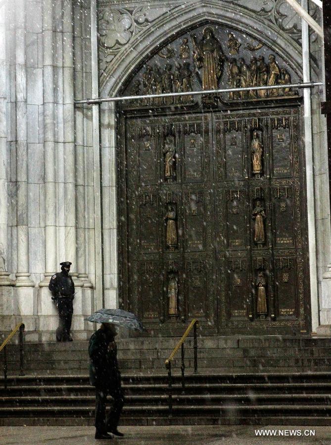 Police guard the St. Patrick's Cathedral on the 5th Avenue in New York, the United States, Nov. 7, 2012. As New Jersey and New York are still trying to recover from the damage created by Hurricane Sandy, a Nor'easter named Winter Storm Athena dropped snow and rain on the Northeast on Wednesday, also bringing dangerous winds and knocking out power. (Xinhua/Wu Jingdan)