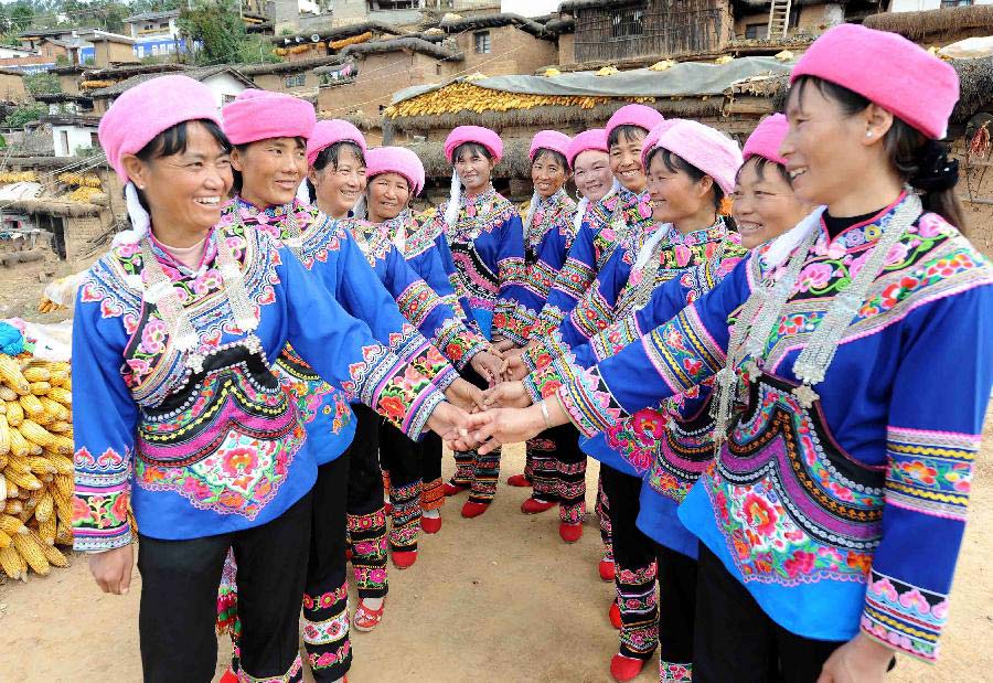 Women of Yi ethnic group dance to celebrate the opening of the 18th National Congress of the Communist Party of China (CPC), in Shuangbai County, southwest China's Yunnan Province, Nov. 8, 2012. The 18th CPC National Congress was opened in Beijing on Thursday. (Xinhua/Yang Zongyou)