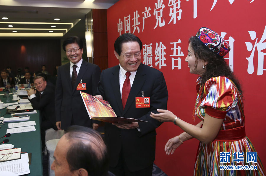 Zhou Yongkang (C) joins a panel discussion of Xinjiang Uygur Autonomous Region delegation to the 18th National Congress of the Communist Party of China (CPC) in Beijing, capital of China, Nov. 8, 2012. The 18th CPC National Congress was opened in Beijing on Thursday. (Xinhua/Pang Xinglei)