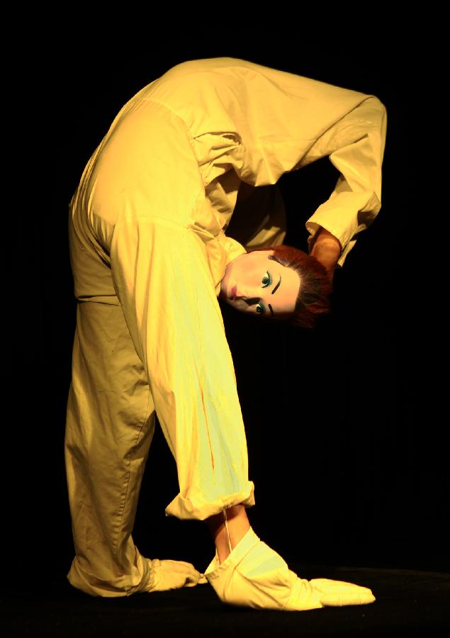 A puppeteer gives performance during the third Shanghai International Puppet Festival in east China's Shanghai, Nov. 9, 2012. The puppet festival, which opened here on Friday, is part of the 14th Shanghai International Arts Festival. The event attracted 11 foreign puppet theatres. (Xinhua/Ding Ting)