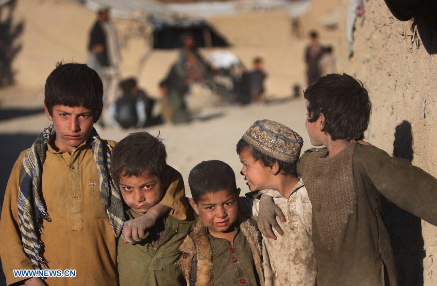 Displaced children are pictured outside their tents at a camp for displaced people in Kabul, Afghanistan, on Nov. 10, 2012. (Xinhua/Ahmad Massoud)