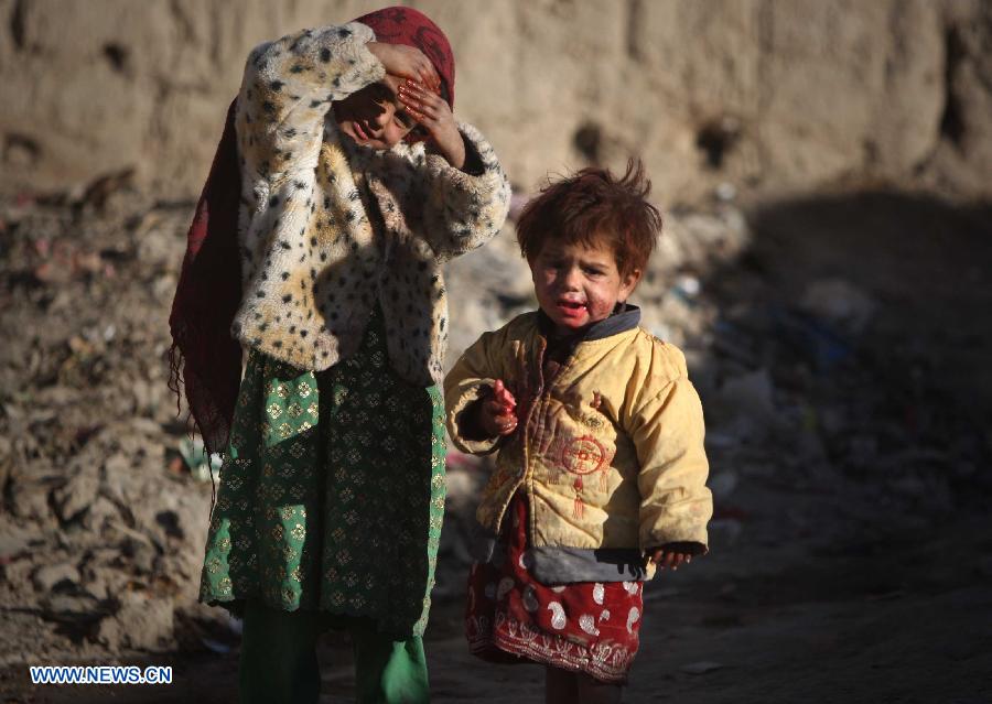 Displaced children are pictured outside their tents at a camp for displaced people in Kabul, Afghanistan, on Nov. 10, 2012. (Xinhua/Ahmad Massoud) 