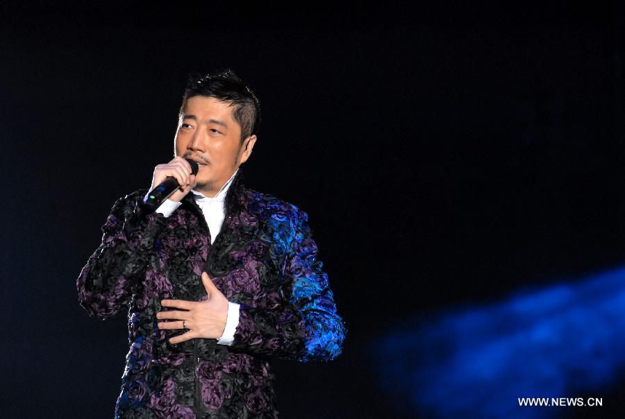 Singer Johnny Chen sings at Rock Records 30th Anniversary Nanjing Concert in Nanjing, capital of east China's Jiangsu Province, Nov. 10, 2012. More than 50 singers performed at the concert. (Xinhua/Wang Yuewu)  