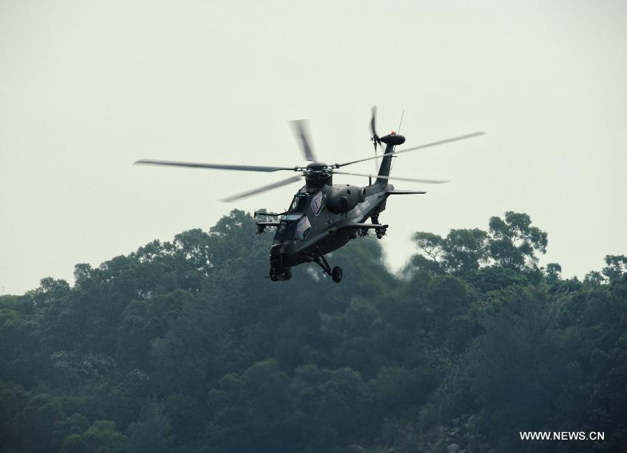 A WZ-10 attack helicopter flies past during a training in Zhuhai, south China's Guangdong Province, Nov. 11, 2012. WZ-10 attack helicopter made its first public appearence before the 9th China International Aviation and Aerospace Exhibition, which will kick off on Tuesday in Zhuhai. (Xinhua/Yang Guang) 