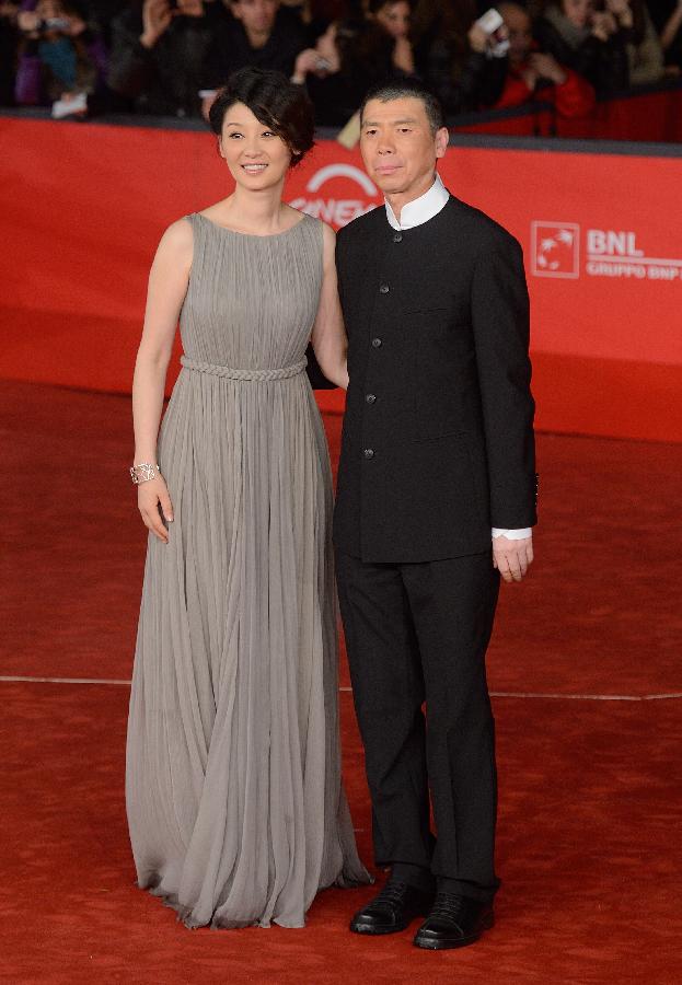 Chinese director Feng Xiaogang (R) and actress Xu Fan (L) pose on the red carpet for the premiere of the film "Back to 1942" at the 7th Rome Film Festival in Rome, capital of Italy, late Nov. 11, 2012. (Xinhua/Wang Qingqin) 