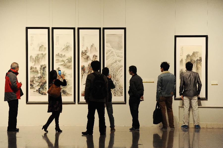 Visitors are pictured at the former site of Shanghai Art Museum in east China's Shanghai Municipality, Nov. 11, 2012. 