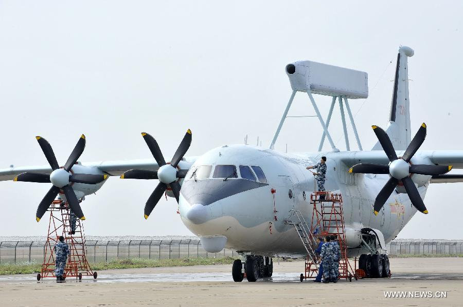 Maintenance staff members of Bayi Aerobatic Team of the People's Liberation Army (PLA) Air Force, check a plane in Zhuhai, south China's Guangdong Province, Nov. 12, 2012. The 9th China International Aviation and Aerospace Exhibition will kick off on Tuesday in Zhuhai. (Xinhua/Liang Xu) 