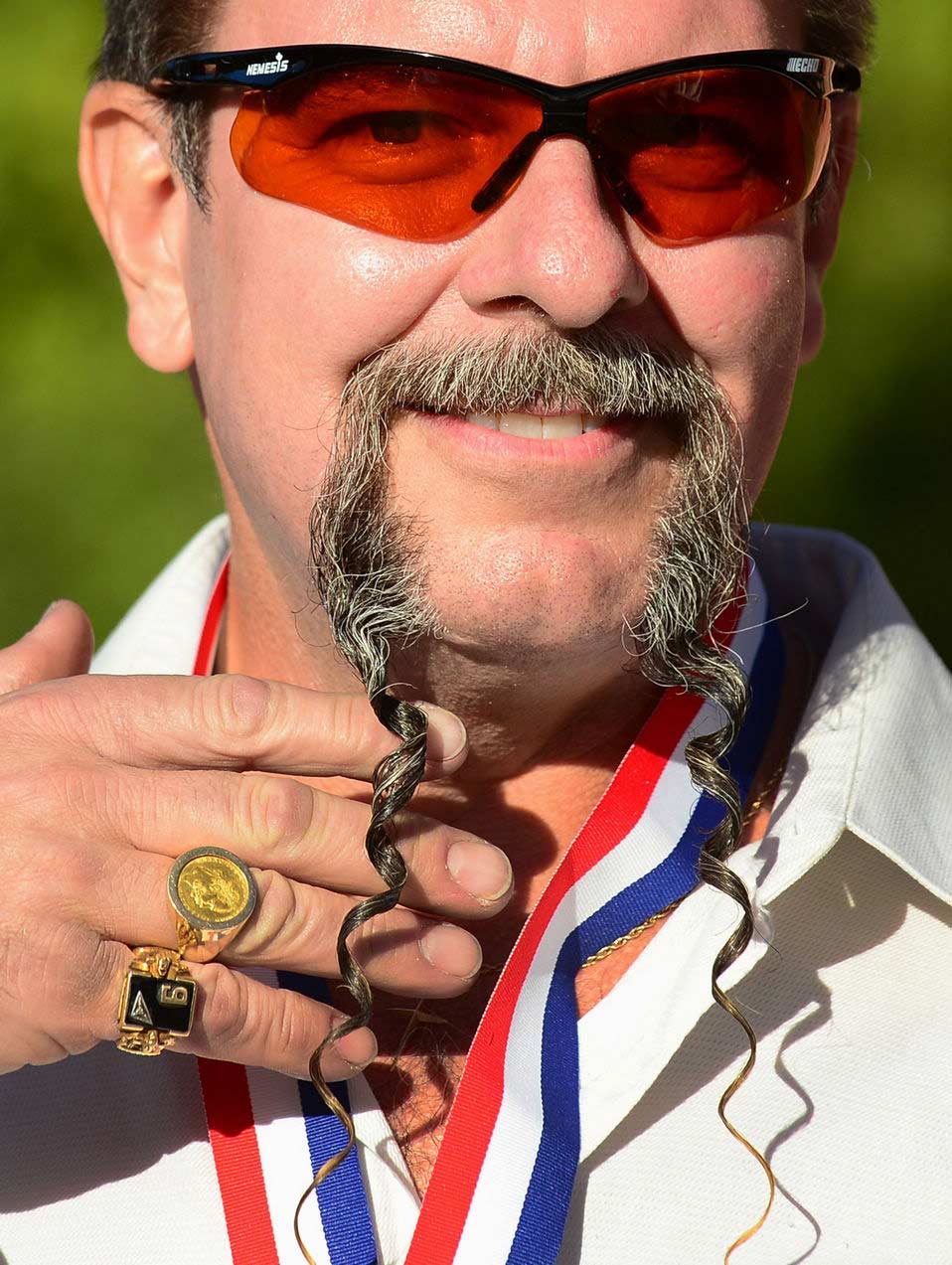 A contestant poses after winning first place in the Freestyle Moustache category at the third annual National Beard and Moustache Championships in Las Vegas, Nevada on November 11, 2012. (Xinhua/AFP)