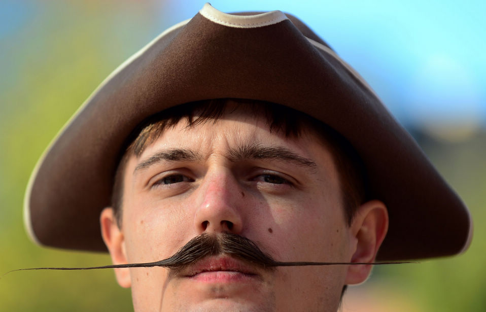 A contestant poses after winning first place in the Freestyle Moustache category at the third annual National Beard and Moustache Championships in Las Vegas, Nevada on November 11, 2012. (Xinhua/AFP)