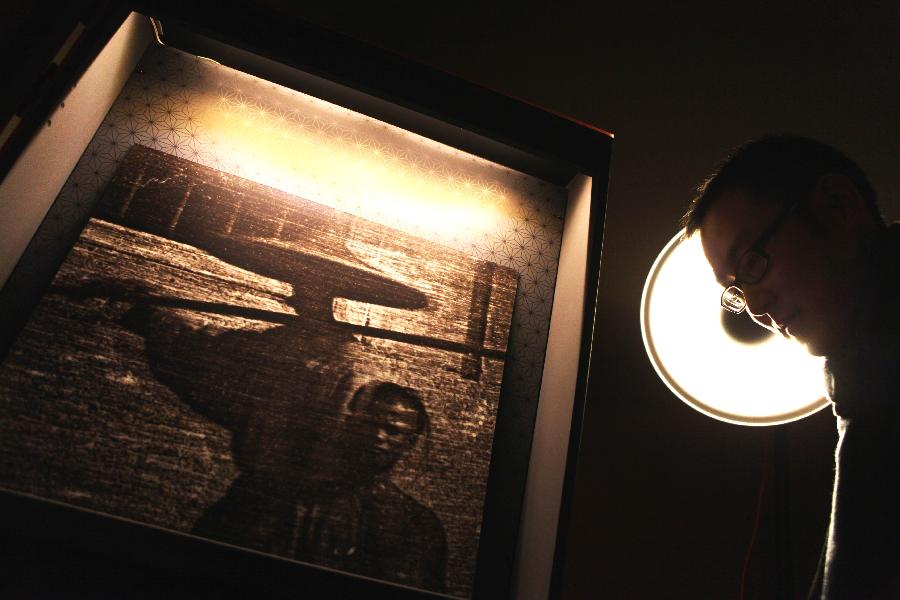 People visit the exhibition of "Earliest Photographs of China" at the Chinese Culture Center in Paris, France, Nov. 13, 2012. (Xinhua/Gao Jing) 