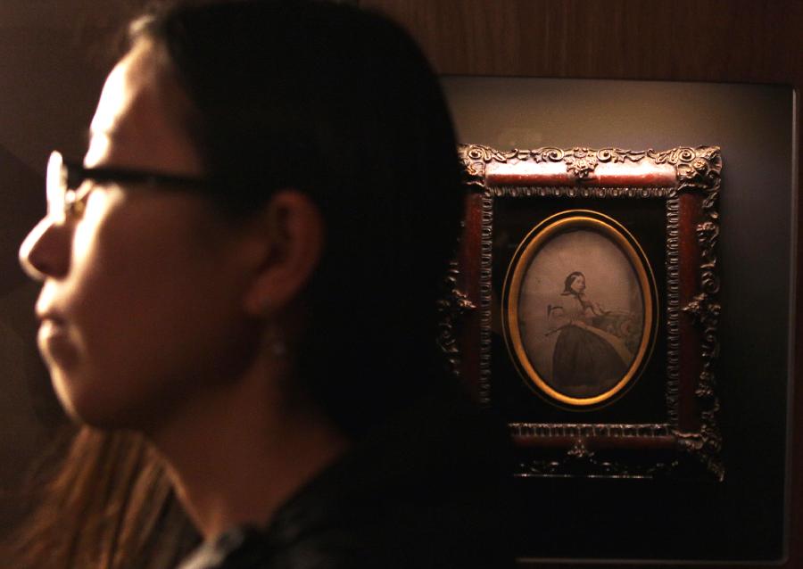 People visit the exhibition of "Earliest Photographs of China" at the Chinese Culture Center in Paris, France, Nov. 13, 2012. (Xinhua/Gao Jing) 