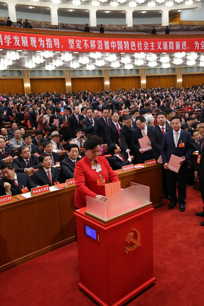 A delegate casts his ballot during the closing session of the 18th National Congress of the Communist Party of China (CPC) at the Great Hall of the People in Beijing, capital of China, Nov. 14, 2012. The congress started its closing session here Wednesday morning, at which a new CPC Central Committee and a new Central Commission for Discipline Inspection will be elected. (Xinhua/Yao Dawei)