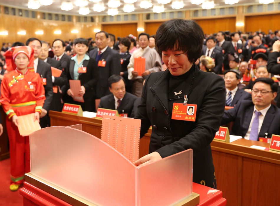 A delegate casts his ballot during the closing session of the 18th National Congress of the Communist Party of China (CPC) at the Great Hall of the People in Beijing, capital of China, Nov. 14, 2012. The congress started its closing session here Wednesday morning, at which a new CPC Central Committee and a new Central Commission for Discipline Inspection will be elected. (Xinhua/Yao Dawei)