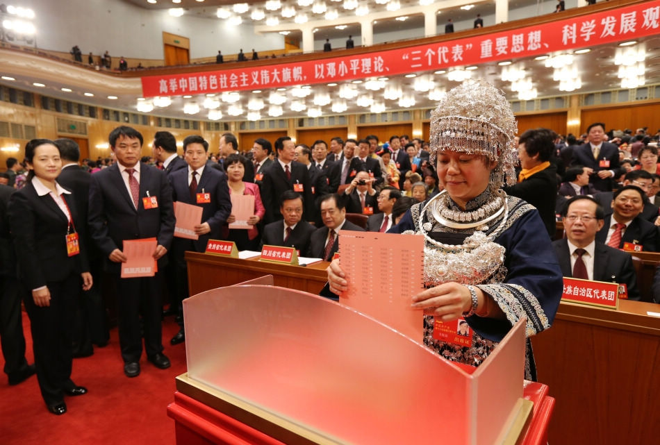 A delegate casts his ballot during the closing session of the 18th National Congress of the Communist Party of China (CPC) at the Great Hall of the People in Beijing, capital of China, Nov. 14, 2012. The congress started its closing session here Wednesday morning, at which a new CPC Central Committee and a new Central Commission for Discipline Inspection will be elected. (Xinhua/Yao Dawei)